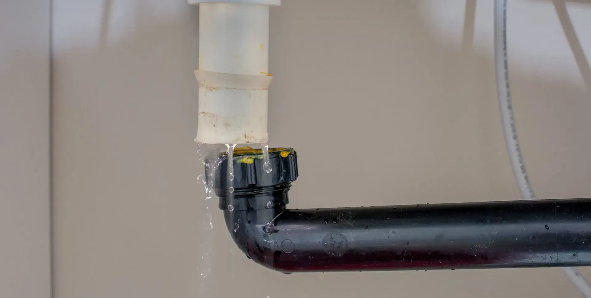 Water leaking from a failed pipe joint